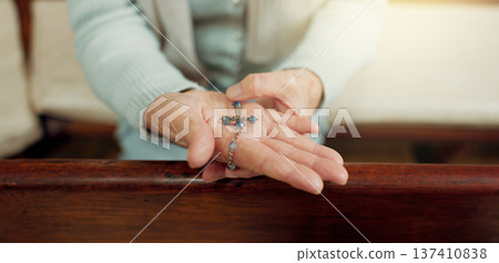 Rosary, prayer or hands of woman in church for God, holy spirit or religion with faith in Christian cathedral. Jewelry closeup, spiritual lady or person in chapel praying to praise Jesus Christ alone 137410838