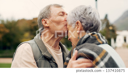 Kiss, forehead and senior couple in a park with love, happy and conversation with romantic bonding. Kissing, old people and elderly man embrace woman with care, romance or soulmate connection outdoor Kiss, forehead and senior couple in a park with love, happy and conversation with romantic bonding. Kissing, old people and elderly man embrace woman with care, romance or soulmate connection outdoor 137410875