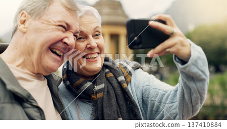 Selfie, smile and senior couple in a park, happy and laugh, relax and bond in nature on the weekend. Love, fun and elderly man and woman relax outdoor with profile picture while enjoying retirement 137410884