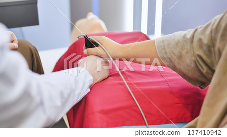 Medical students practicing CPR and first aid skills on a simulation mannequin Medical students practicing CPR and first aid skills on a simulation mannequin 137410942