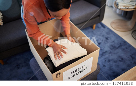 Donation boxes, charity and woman with clothing for nonprofit and cardboard container at home. Lounge, donating and house with giveaway and spring cleaning for community support with packing package 137411038