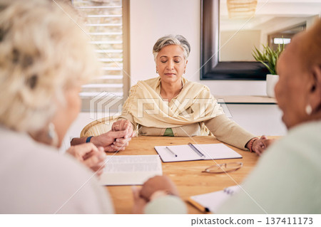 Senior people, group prayer and holding hands at table together, support and worship Holy Spirit, Jesus Christ and God. Elderly friends, religion and gratitude in home, hope and spiritual faith. 137411173