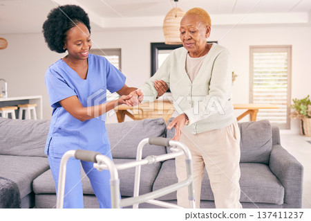 Doctor, senior woman and walking frame for support, healthcare service and helping with balance and disability. Medical physiotherapist, caregiver or nurse with african elderly patient in living room Doctor, senior woman and walking frame for support, healthcare service and helping with balance and disability. Medical physiotherapist, caregiver or nurse with african elderly patient in living room 137411237