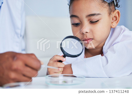 Child, science and girl with a magnifying glass in laboratory learning, research or curious to study chemistry in education. Kid, scientist and check with a magnifier on experiment, test or analysis 137411248