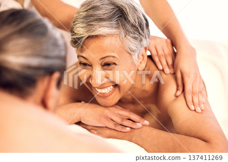 Spa, relax and couple on massage table for luxury, resort and vacation with stress relief, zen and anniversary. People, mature man and senior woman with happiness, holiday and body care with wellness Spa, relax and couple on massage table for luxury, resort and vacation with stress relief, zen and anniversary. People, mature man and senior woman with happiness, holiday and body care with wellness 137411269