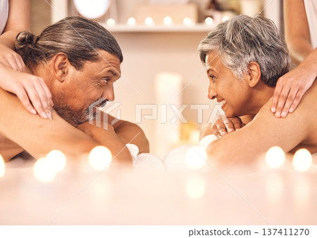 Mature couple, romantic massage at spa in candle light and wellness, relax and smile together. Holistic health therapy, zen and calm man with woman in profile on table in luxury salon in retirement. Mature couple, romantic massage at spa in candle light and wellness, relax and smile together. Holistic health therapy, zen and calm man with woman in profile on table in luxury salon in retirement. 137411270