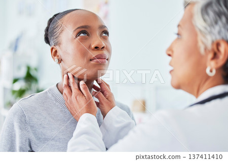 Sore throat, doctor and woman patient in hospital for virus, pain or infection. Healthcare worker and sick African person check neck for thyroid exam or respiratory care at medical consultation 137411410