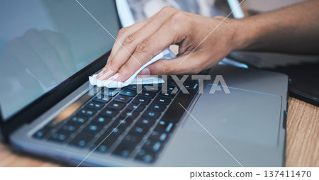 Cleaning, wipe dust and hands with laptop for hygiene, disinfection and maintenance for health in office. Technology, closeup and keyboard for bacteria, dust and dirt on computer for clean workplace 137411470