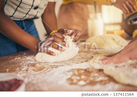 Bakery, hands and baking by people or chef on a kitchen table cooking bread, pizza or pastry with dough. Culinary, counter and person preparing food at a restaurant with ingredient or recipe Bakery, hands and baking by people or chef on a kitchen table cooking bread, pizza or pastry with dough. Culinary, counter and person preparing food at a restaurant with ingredient or recipe 137411564