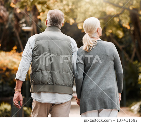 Holding hands, love and back with old couple in nature for bonding, happy and support. Relax, happiness and retirement with senior man and woman walking in countryside for vacation and commitment Holding hands, love and back with old couple in nature for bonding, happy and support. Relax, happiness and retirement with senior man and woman walking in countryside for vacation and commitment 137411582