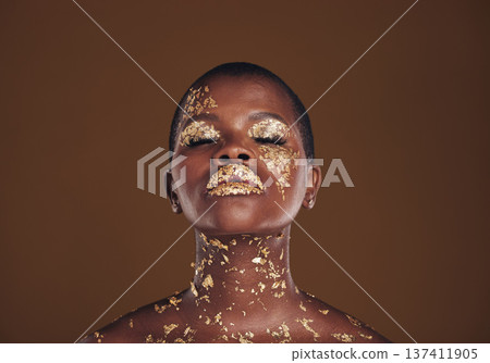 Beauty, glitter and black woman with gold makeup on brown background with art, paint and cosmetics. Shine, glow and African model in studio for facial fashion, aesthetic freedom and luxury skincare. Beauty, glitter and black woman with gold makeup on brown background with art, paint and cosmetics. Shine, glow and African model in studio for facial fashion, aesthetic freedom and luxury skincare. 137411905