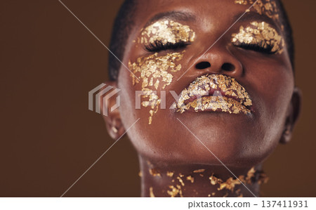 Gold, art and face of African woman with makeup for beauty aesthetics isolated in a studio brown background eyes closed. Creative, luxury and person with cosmetic glamour or design for skincare Gold, art and face of African woman with makeup for beauty aesthetics isolated in a studio brown background eyes closed. Creative, luxury and person with cosmetic glamour or design for skincare 137411931