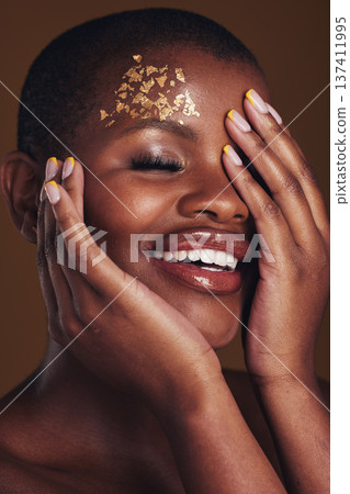 Art, cosmetics and black woman with gold makeup on brown background, glitter paint and beauty. Shine, glow and African model in studio for fashion inspiration, aesthetic freedom and luxury skincare. 137411995