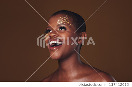 Gold, makeup and woman laughing with beauty and luxury treatment and creative spa mask. Glitter, art dermatology and African female person happy from skincare and golden cosmetics in studio Gold, makeup and woman laughing with beauty and luxury treatment and creative spa mask. Glitter, art dermatology and African female person happy from skincare and golden cosmetics in studio 137412013