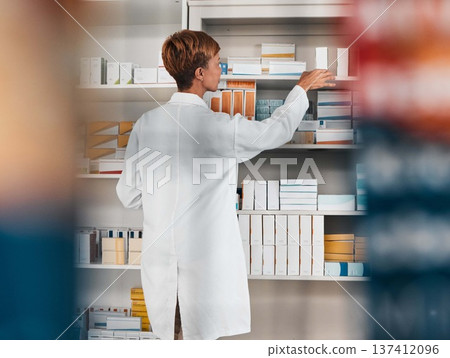 Woman, pharmacist and inventory inspection on shelf for pills, tablets or medication at the pharmacy. Female person, healthcare or medical worker checking stock or pharmaceutical at the drugstore Woman, pharmacist and inventory inspection on shelf for pills, tablets or medication at the pharmacy. Female person, healthcare or medical worker checking stock or pharmaceutical at the drugstore 137412096
