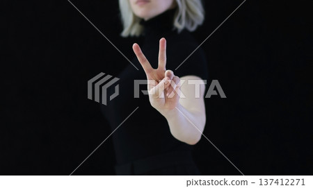 The index and middle fingers palm from the letter V, which means Victory. The index and middle fingers palm from the letter V, which means Victory. 137412271
