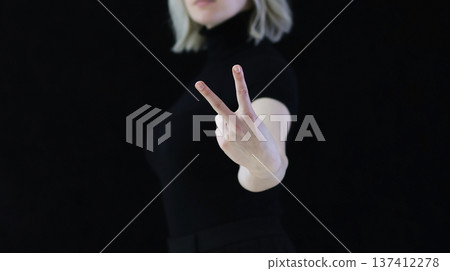 The index and middle fingers palm from the letter V, which means Victory. The index and middle fingers palm from the letter V, which means Victory. 137412278