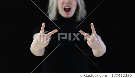 The index and middle fingers palm from the letter V, which means Victory. The index and middle fingers palm from the letter V, which means Victory. 137412320