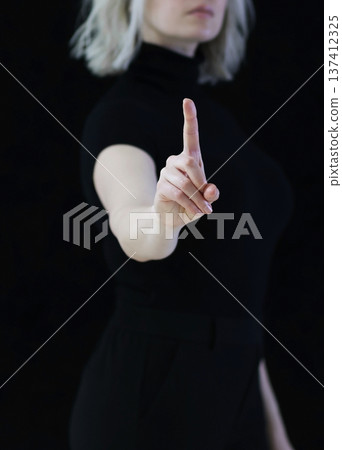 The index finger of the hand points upwards which means carefully, attentively. The index finger of the hand points upwards which means carefully, attentively. 137412325