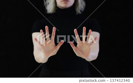 A gesture of open palms in front of you, which means calm down, I won't hurt you. A gesture of open palms in front of you, which means calm down, I won't hurt you. 137412340