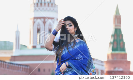 Indian woman wearing sari in Moscow with Kremlin Indian woman wearing sari in Moscow with Kremlin 137412390