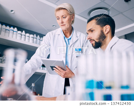 Scientist, mentor and training on tablet for data analysis, laboratory report and pharmaceutical research. Science teamwork, medical woman and man on digital technology for support and drugs solution Scientist, mentor and training on tablet for data analysis, laboratory report and pharmaceutical research. Science teamwork, medical woman and man on digital technology for support and drugs solution 137412430