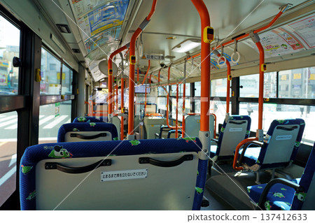 Inside a Toei bus traveling through the city on a sunny day Inside a Toei bus traveling through the city on a sunny day 137412633