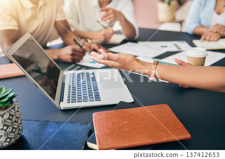 Meeting, hands of business people with laptop and paperwork for training, motivation and collaboration. Teamwork, men and women at office desk with computer, documents and brainstorming at workshop. 137412653