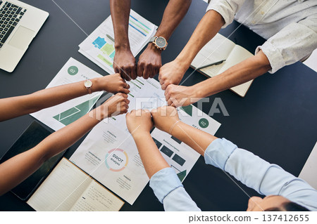 Fist circle, business people and documents with group, teamwork and planning at startup, office or top view. Team building, hands and synergy with link, connection or paperwork for start in workplace 137412655