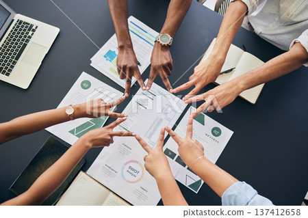 Star fingers, team and documents in office, group and peace sign with planning, startup and top view at desk. Business people, hands and synergy with link, icon and paperwork for growth in workplace 137412658