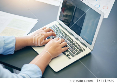 Laptop, hands and closeup of businesswoman typing working on company website development. Technology, online and professional female web designer doing research on computer for startup in workplace. Laptop, hands and closeup of businesswoman typing working on company website development. Technology, online and professional female web designer doing research on computer for startup in workplace. 137412689