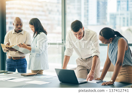 Meeting, business people with laptop and paperwork for workshop, motivation and collaboration. Teamwork, men and women at office desk together with computer, documents and brainstorming in training. 137412741