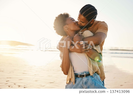 Beach sunset, sunshine and black couple hug, kiss and enjoy time together, support and romance on travel holiday. Marriage, flare or hugging African people connect, care and bond on anniversary break Beach sunset, sunshine and black couple hug, kiss and enjoy time together, support and romance on travel holiday. Marriage, flare or hugging African people connect, care and bond on anniversary break 137413096