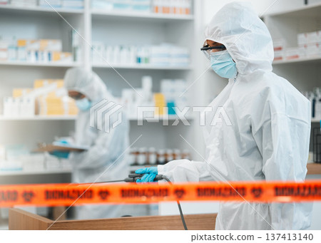 Biohazard, chemical and disinfect with people in a pharmacy for decontamination after a medical accident. Hazmat, spray or cleaning with healthcare personnel in a drugstore to sanitize and isolate Biohazard, chemical and disinfect with people in a pharmacy for decontamination after a medical accident. Hazmat, spray or cleaning with healthcare personnel in a drugstore to sanitize and isolate 137413140
