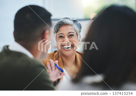 Team, happy woman or business people in meeting laughing at funny joke in discussion or collaboration together. Smile, leadership or excited mature mentor talking or speaking of ideas to employees Team, happy woman or business people in meeting laughing at funny joke in discussion or collaboration together. Smile, leadership or excited mature mentor talking or speaking of ideas to employees 137413254