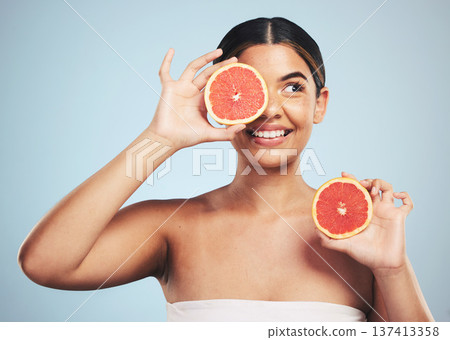 Smile, skincare and woman in studio with grapefruit for natural skin beauty or wellness on grey background. Happy, fruit and female model with citrus cosmetics for vitamin c, collagen and exfoliate 137413358