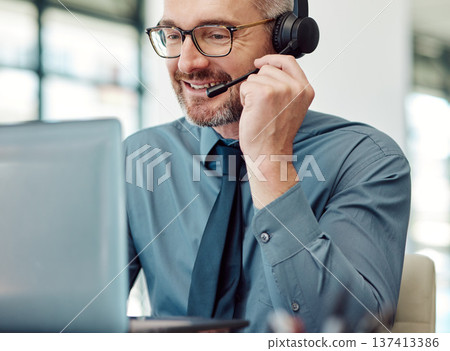 Senior, happy man and call center on laptop with headphones in customer service or telemarketing at office. Mature businessman, consultant or agent smile in online advice, help or contact us at desk 137413386
