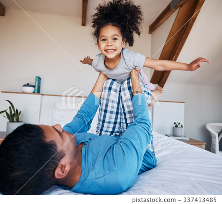 Portrait, airplane and smile of girl child with father in bedroom flying for fantasy, happiness, and fun in modern apartment. Face, love and man lifting young kid on knee in family home for play Portrait, airplane and smile of girl child with father in bedroom flying for fantasy, happiness, and fun in modern apartment. Face, love and man lifting young kid on knee in family home for play 137413485