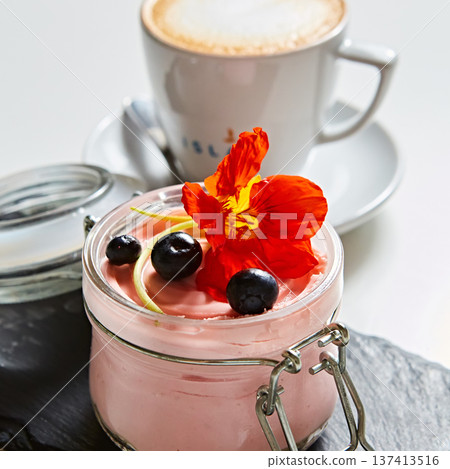 Luxury pink berry mousse served in an artisanal glass jar with fresh blueberries Luxury pink berry mousse served in an artisanal glass jar with fresh blueberries 137413516