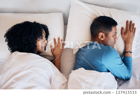 Frustrated couple, fight and lying in bed conflict, divorce or argument from disagreement or dispute at home. Top view of woman and man in breakup, cheating affair or toxic relationship in bedroom 137413533