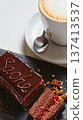 Vibrant sliced Sachertorte cake with rich chocolate ganache and apricot layers 137413537