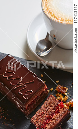 Vibrant sliced Sachertorte cake with rich chocolate ganache and apricot layers Vibrant sliced Sachertorte cake with rich chocolate ganache and apricot layers 137413537