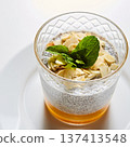 Artisanal breakfast parfait featuring layered chia seed pudding, mango puree 137413548