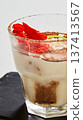 Artisanal tiramisu served in a modern glass with a heavy dusting of cocoa powder 137413567