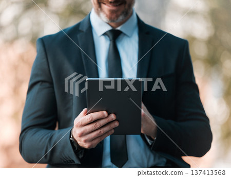 Outdoor, business and man with a tablet, closeup and connection with social media, typing and email notification. Person, broker or accountant with technology, city and online reading for information 137413568
