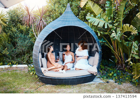 Travel, luxury and women or friends on vacation and in conversation happy for an outdoor getaway together. Wine, laughing and people on holiday in nature bonding in happiness in a modern tent 137413594