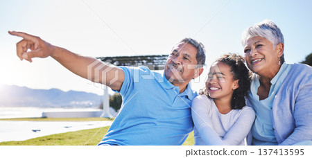 Happy, talking or grandparents with child in nature bonding to relax with care in retirement on mockup space. Smile, grandmother or senior grandfather pointing with a kid on holiday in summer park 137413595