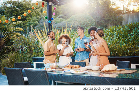 Laughing, diversity and friends at lunch in a garden with drinks, conversation and talking at a party. Happy, alcohol and group of men and women at an outdoor backyard dinner with communication 137413601