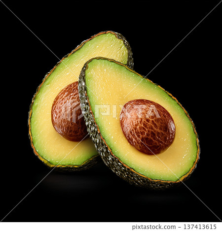 Fresh avocado half with pit isolated on black background 137413615