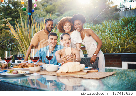 Selfie, friends at dinner together in garden and happy event with diversity, food and wine for outdoor party. Photography, men and women at table, group of people with drinks in backyard at sunset. 137413639